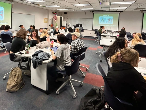 students seated around the room at club event