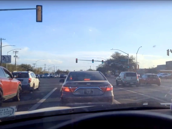 View of the street from a car dashboard
