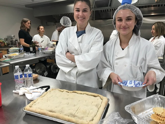 Italian students cooking focaccio bread