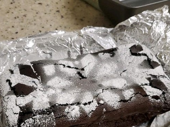 Chocolate cake with a powdered sugar pattern on top