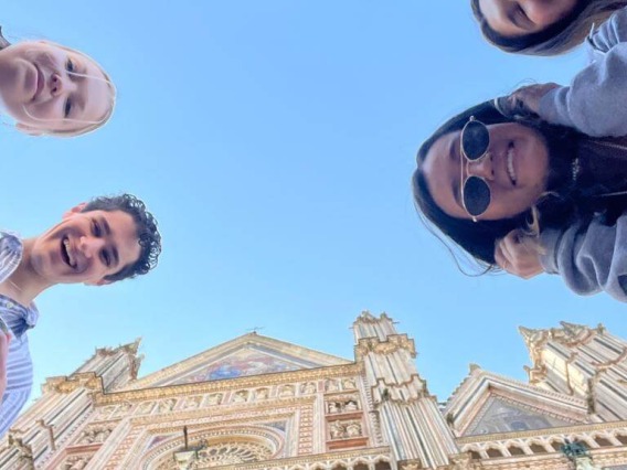 Looking up at group of students in front of Italian Cathedral