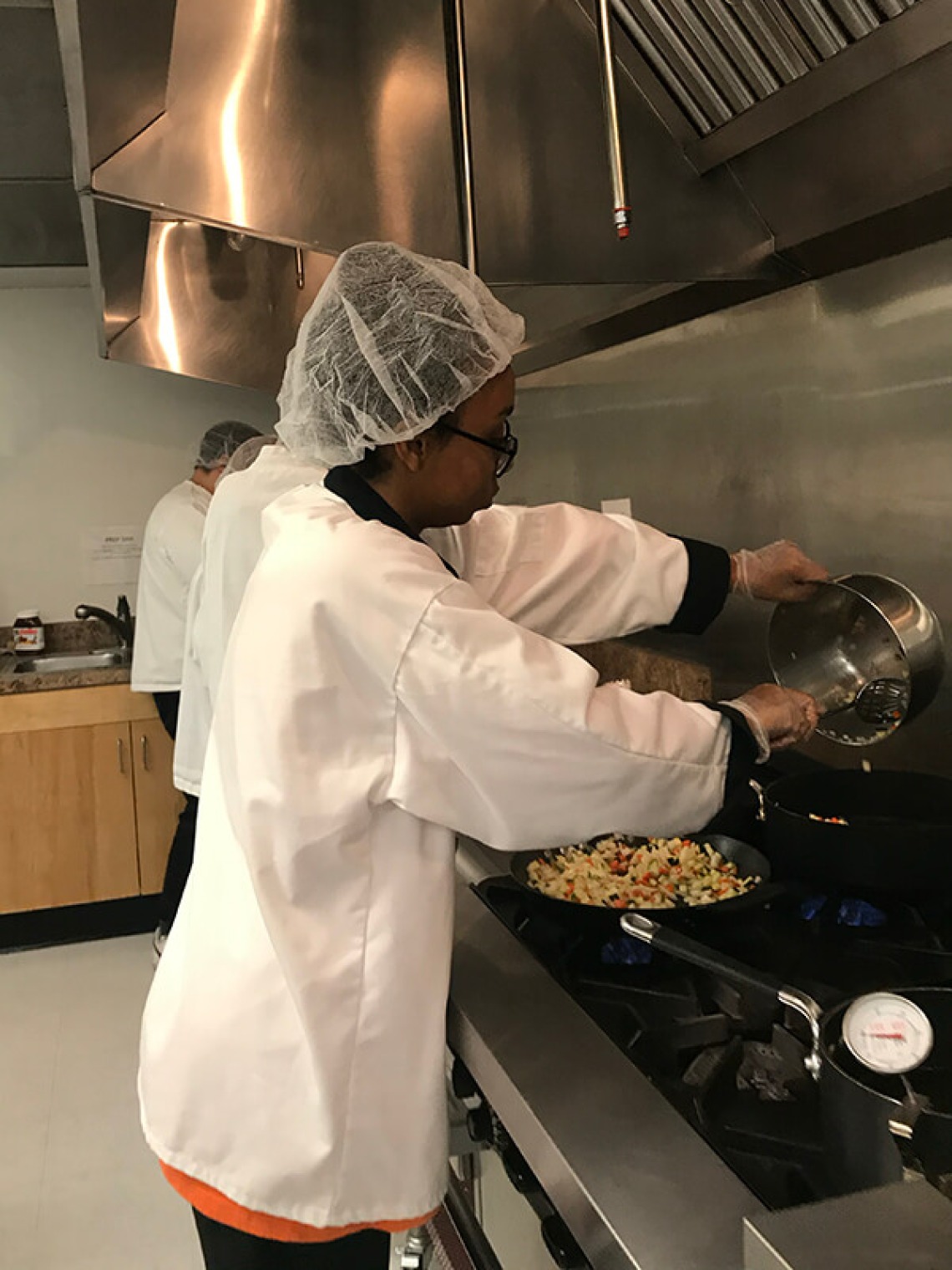 Italian students cooking at the stove