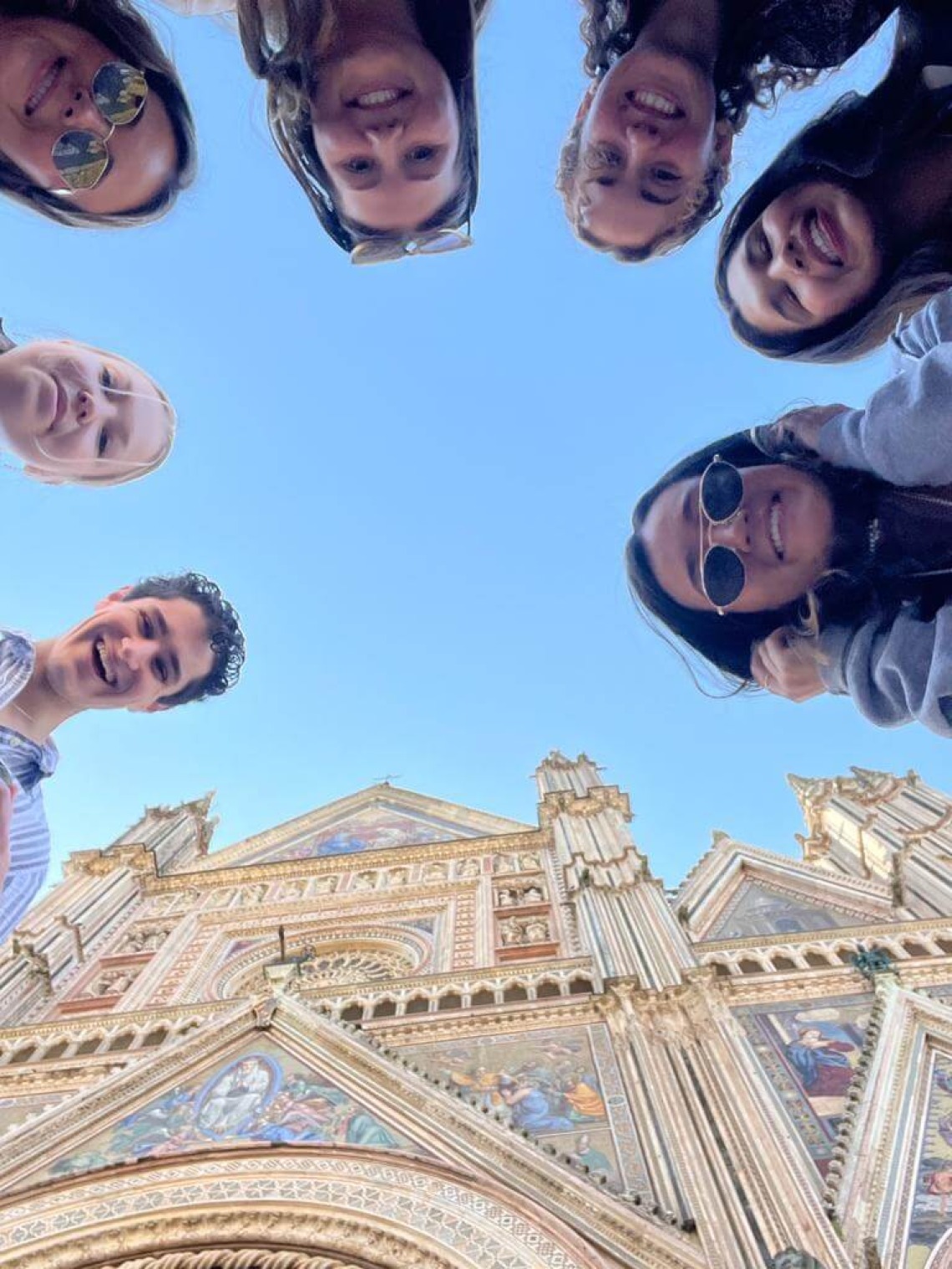 Looking up at group of students in front of Italian Cathedral