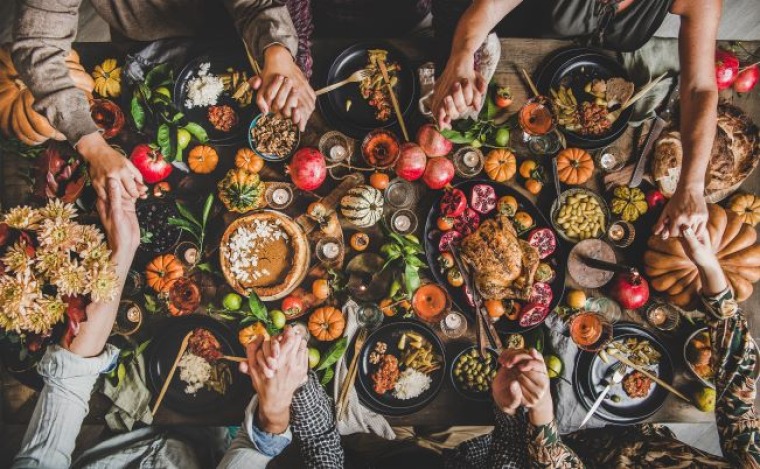 Thanksgiving table with lots of food